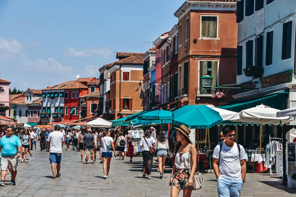 things to do in Burano: Did you know the locals created Piazza Baldassarne Galuppi after they filled in one of the canals? Today, visiting this charming square, lined with restaurants, is one of the best things to do in Burano. It is a perfect place to grab a snack or refreshing drink.