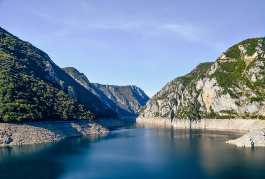 places to visit in Monenegro: Piva Lake in the Piva Canoyn is also one of the best places to visit in Montenegro becuase this lake is one of the most beautiful lakes in the country. Also, the are has many mountain peaks, thick woods, and many scenic viewpoints. Also, cruising on the river is a popular attraction on the Piva Lake.