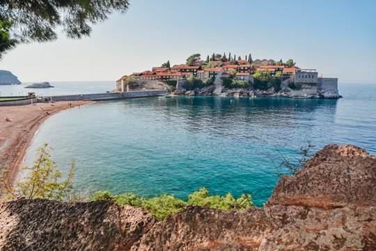 things to do in Montentegro: Exploring beautiful Sveti Stefan is one of the best things to do in Montenegro because this walled island is from the 15th century. In the past Sveti Stefan was famous as the playground of celebrities. Today Sveti Stefan is one of the most beautiful places to visit in Montengero because it has beutiful beach, world-famous hotel and is very picturesque..